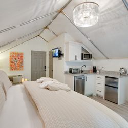 ReTreet - The inside of one of six on-site climage controlled glamping tents featuring private bath, kitchenette and deck.