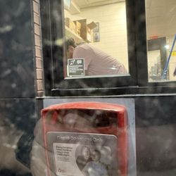McDonald's - Drive through completely full with line going around the building and this guy is checking snap