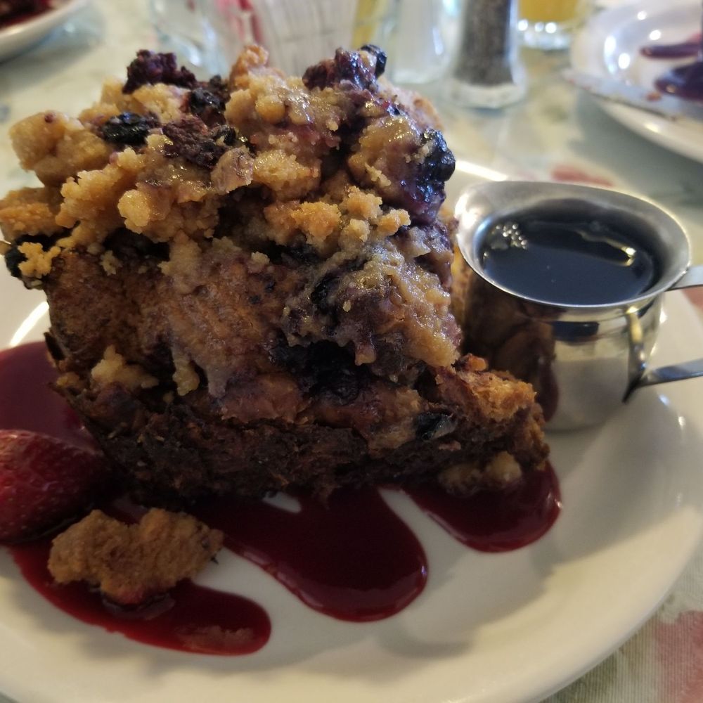 The giant Oven Baked French Toast is layered with cinnamon rolls, Texas toast, croissants, blueberries, raspberries, & topped with streusel The giant Oven Baked French Toast is layered with cinnamon rolls, Texas toast, croissants, blueberries, raspberries, & topped with streusel