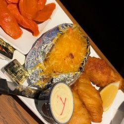 Bocce's Bar and Grill - Beer, battered fish with a fully loaded, baked potato and carrots