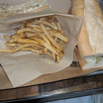 Tricky Fish - The blackened catfish po'boy and fries... - Seafood Near Me - Richardson, Texas Tricky Fish - The blackened catfish po'boy and fries... - Seafood Near Me - Richardson, Texas