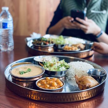 Namaste Shangri-La - a man sitting at a table with a plate of food - Himalayan/Nepalese Near Me - Anchorage, Alaska Namaste Shangri-La - a man sitting at a table with a plate of food - Himalayan/Nepalese Near Me - Anchorage, Alaska
