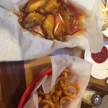 Wings Etc - Extra wet medium wings and curly fries - Sports Bars Near Me - Mishawaka, Indiana