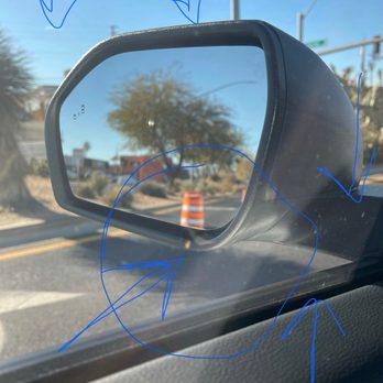 Flores Window Tinting - Shows air bubbles and specs of dirt. The arrow in the circle shows a bigger piece of dirt just tinted over. - Car Window Tinting Near Me - Las Vegas, Nevada