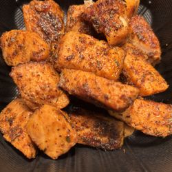 Speakeasy Lounge - Grilled salmon bites come with hand cut broad street fries or yellow rice..