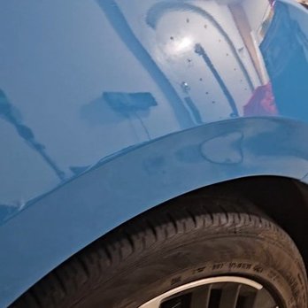 Dynodent Paintless Dent Repair - 2025 Nissan. This after photo of the repair was taken in the clients garage. - Mobile Dent Repair Near Me - Addison, Texas