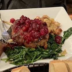 Hampton Junction - Pork chops with cranberry sauce, stuffing over a bed of spinach