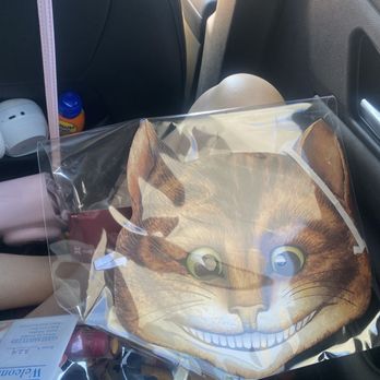 Convivio Bookworks - Cheshire Cat mask for cheering up the big , bad , MAD world - Specialty Food Near Me - Lake Worth Beach, Florida Convivio Bookworks - Cheshire Cat mask for cheering up the big , bad , MAD world - Specialty Food Near Me - Lake Worth Beach, Florida