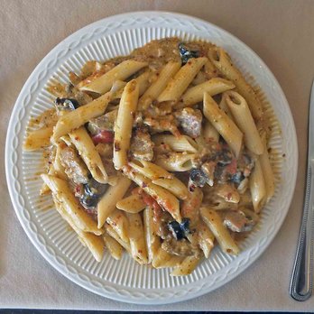 The Branding Iron - Penne pasta with Italian sausage, black olives, onions, mushrooms, pesto, garlic, pepper flakes and parmesan with 2/1 Alfredo and marinara. - Breakfast & Brunch Near Me - Kerrville, Texas The Branding Iron - Penne pasta with Italian sausage, black olives, onions, mushrooms, pesto, garlic, pepper flakes and parmesan with 2/1 Alfredo and marinara. - Breakfast & Brunch Near Me - Kerrville, Texas