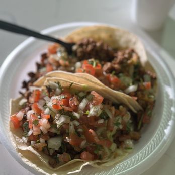Rolando's Mexican Food - Two adobado tacos that come with pico de gallo and a bit of guacamole - Mexican Near Me - Phoenix, Arizona