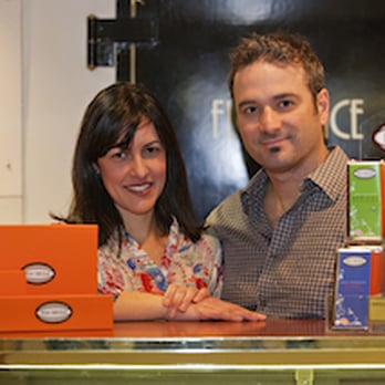 Posh Chocolat - a man and a woman behind a counter - Chocolatiers & Shops Near Me - Bonner, Montana