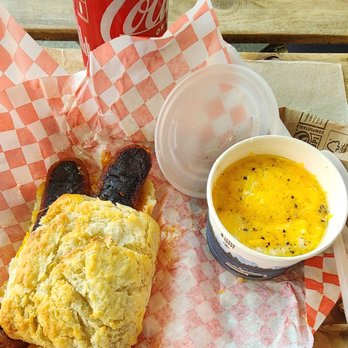 Biscuit Bitch - egg, cheddar, and grilled Louisiana hot link Bitchwich with cheddar garlic grits - Breakfast & Brunch Near Me - Seattle, Washington Biscuit Bitch - egg, cheddar, and grilled Louisiana hot link Bitchwich with cheddar garlic grits - Breakfast & Brunch Near Me - Seattle, Washington