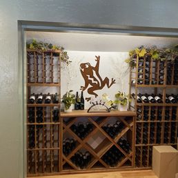 a wine rack with wine bottles