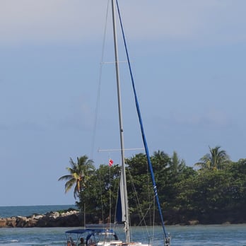 South Pointe Park - A sailboat passes by South Pointe Park. - Parks Near Me - Miami Beach, Florida