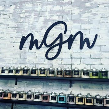 MGM Nutrition & Delights - a brick wall and shelves with jars of food - Juice Bars & Smoothies Near Me - Gainesville, Texas