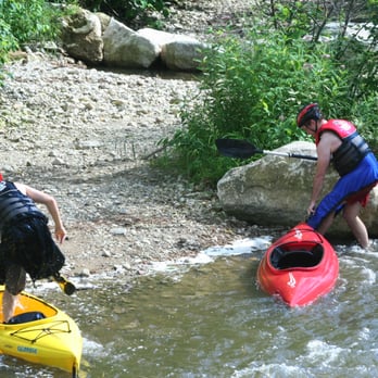Bear River Recreation Area - Bailing out a kayak after flipping in the rapids - Parks Near Me - Petoskey, Michigan