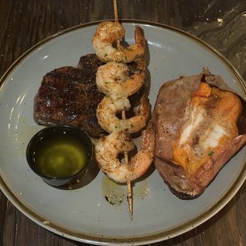 Spotted Cow Steakhouse - Filet Mignon - 9 oz. With Shrimp and Baked Sweet Potato - Steakhouses Near Me - Winston-Salem, North Carolina Spotted Cow Steakhouse - Filet Mignon - 9 oz. With Shrimp and Baked Sweet Potato - Steakhouses Near Me - Winston-Salem, North Carolina