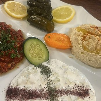 Chef's Table Mediterranean Grill - 4 plate Appetizer clockwise- dolmas , hummus, cacik, muammara - Mediterranean Near Me - Webster, Texas Chef's Table Mediterranean Grill - 4 plate Appetizer clockwise- dolmas , hummus, cacik, muammara - Mediterranean Near Me - Webster, Texas