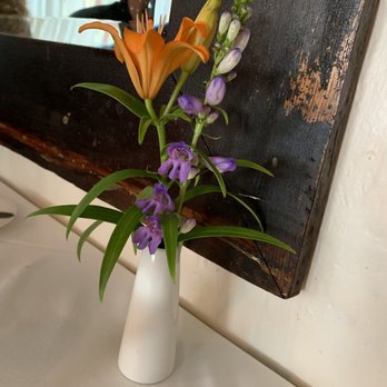La Bécasse - Sweet flower arrangement on the table. - French Near Me - Maple City, Michigan La Bécasse - Sweet flower arrangement on the table. - French Near Me - Maple City, Michigan