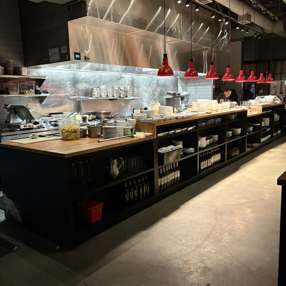 Tavolàta - Kitchen view - pasta machine at the very end. - Wine Bars Near Me - Redmond, Washington Tavolàta - Kitchen view - pasta machine at the very end. - Wine Bars Near Me - Redmond, Washington