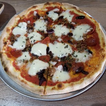 Moku Kitchen - Proletariat Pizza - Pepperoni, sausage, onions, olives, and fresh mozzarella. No green peppers. - Cocktail Bars Near Me - Honolulu, Hawaii