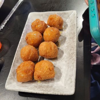South By Saigon - Hush puppies that taste like they came from a Sam's Club freezer, drizzled with too little honey to justify listing on a dessert menu. - Seafood Near Me - Houston, Texas South By Saigon - Hush puppies that taste like they came from a Sam's Club freezer, drizzled with too little honey to justify listing on a dessert menu. - Seafood Near Me - Houston, Texas