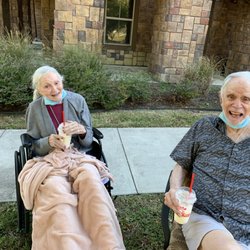 TheKey - Senior Home Care - Mom & Dad at a tailgate. They are kind people. Everyone loves them except homecare assistance