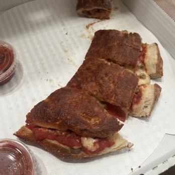 Uncle Al's Pizzeria - Pizza folder over pepperoni & sausage - Pizza Near Me - Elyria, Ohio