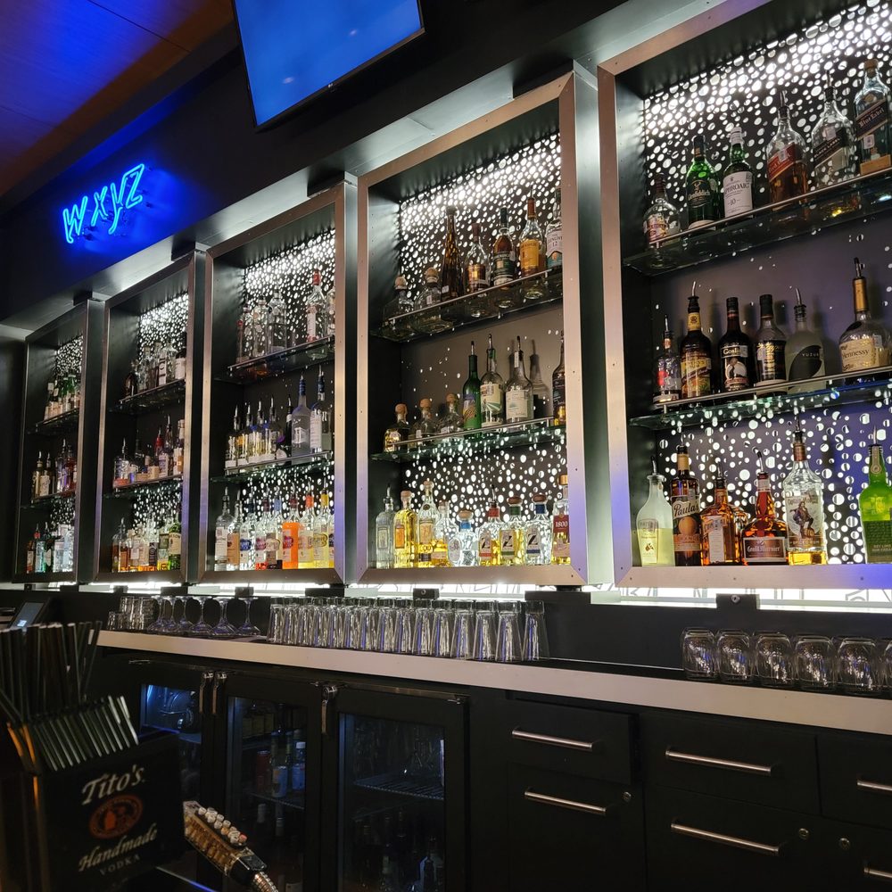 W XYZ Bar - bottles of alcohol on shelves - Cocktail Bars Near Me - Austin, Texas W XYZ Bar - bottles of alcohol on shelves - Cocktail Bars Near Me - Austin, Texas