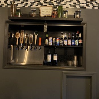 Happy Endings - a bar with bottles of alcohol - Cocktail Bars Near Me - Bangor, Maine