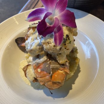 Travesias - Lobster tail on a bed of Monfongo - Latin American Near Me - Bronx, New York Travesias - Lobster tail on a bed of Monfongo - Latin American Near Me - Bronx, New York