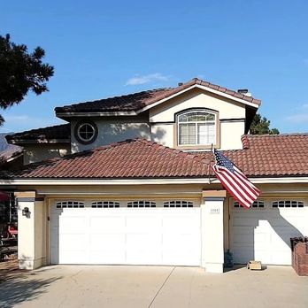 Summit Solar And Roofing - a house with an american flag on the roof - Roofing Near Me - San Bernardino, California Summit Solar And Roofing - a house with an american flag on the roof - Roofing Near Me - San Bernardino, California