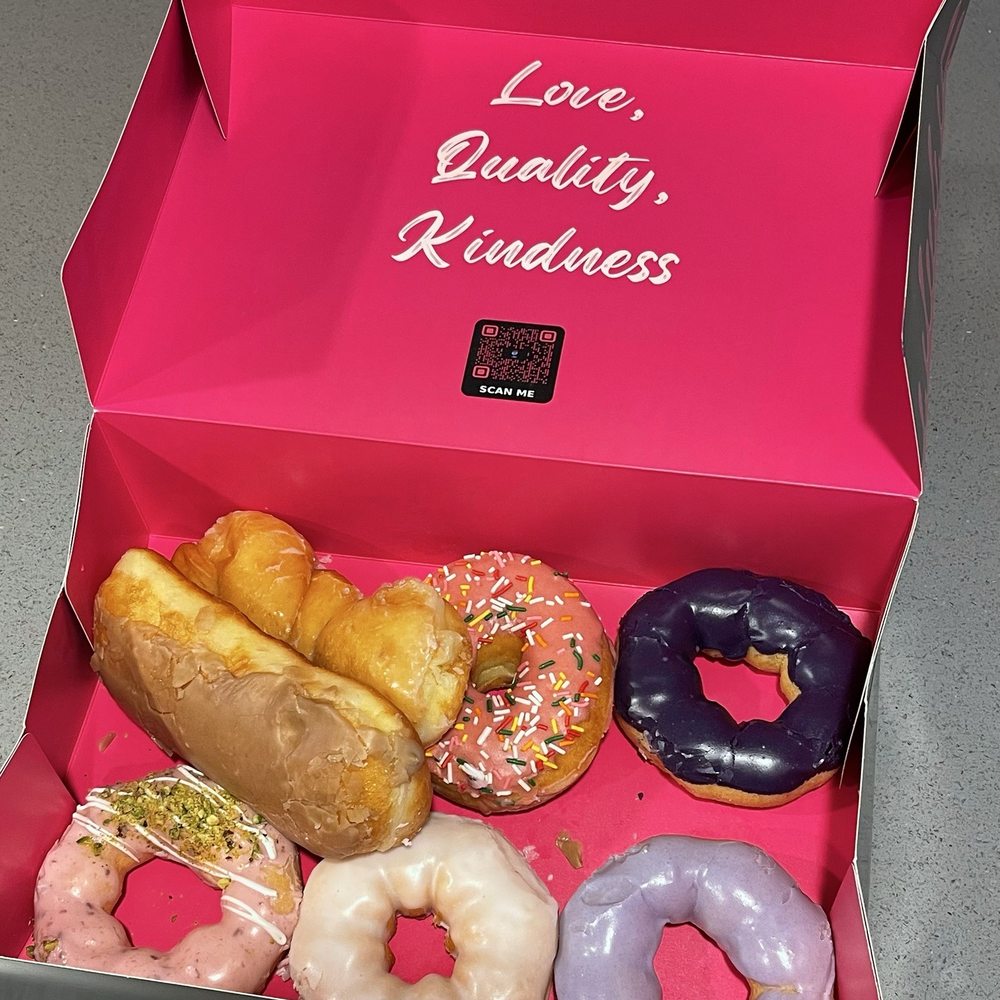Top row left to right: Maple Bar, Classic Twist, Homer Simpson, Ube Mochi. Bottom row: Raspberry Pistachio Mochi, Classic Mochi, Taro Mochi Top row left to right: Maple Bar, Classic Twist, Homer Simpson, Ube Mochi. Bottom row: Raspberry Pistachio Mochi, Classic Mochi, Taro Mochi