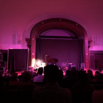 The Concert Hall - a man playing a piano on stage - Music Venues Near Me - New York, New York The Concert Hall - a man playing a piano on stage - Music Venues Near Me - New York, New York