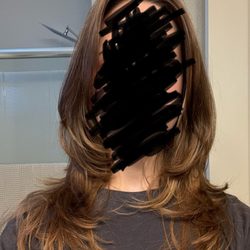 Strange Powers Salon - $135 for a shag cut with crooked layers when I asked for long round layers. Horrible cut by Geneva