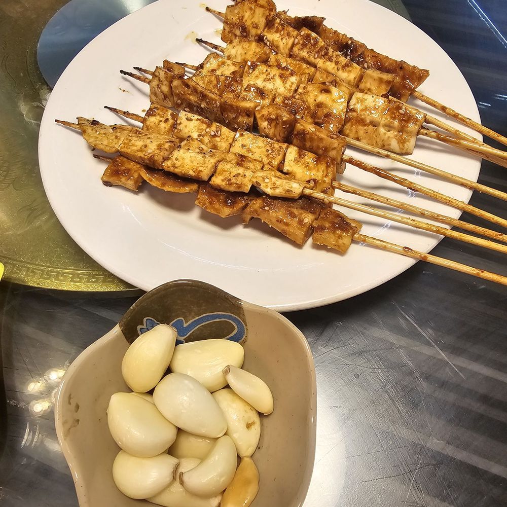 5885 BBQ - a plate of chicken skewers and a bowl of garlic - Chinese Near Me - Scarborough, Ontario 5885 BBQ - a plate of chicken skewers and a bowl of garlic - Chinese Near Me - Scarborough, Ontario