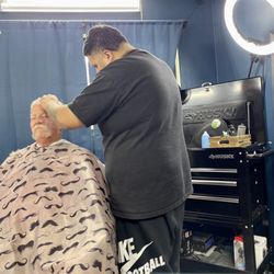 Made Men Cuts - Awesome hair cut by Miguel.  Love the tool boxes used for their barber stations