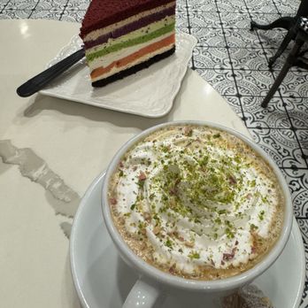 Utopia Caffe - Cafe Latte with a rainbow cake - Breakfast & Brunch Near Me - Tustin, California Utopia Caffe - Cafe Latte with a rainbow cake - Breakfast & Brunch Near Me - Tustin, California