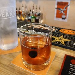 Oak & Alley - Basic Old Fashioned with Knob Creek, Large Cube of Ice, an Orange slice and spiced cherry! Very solid version!