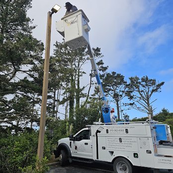 Tarin Electric & Lighting - Utility technician performing outdoor lighting maintenance using a bucket truck to service or replace a pole-mounted light fi... - Electricians Near Me Tarin Electric & Lighting - Utility technician performing outdoor lighting maintenance using a bucket truck to service or replace a pole-mounted light fi... - Electricians Near Me