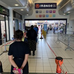 Meadows Shopping Centre - Queue to go in. Sanitiser available on entry.