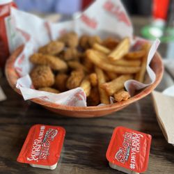 St Louis Bar & Grill - Boneless chicken meat with fries