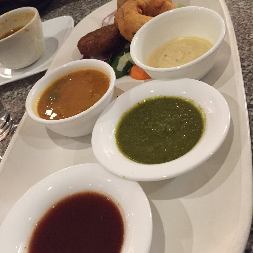 Udupi Indian Vegetarian & Vegan Cuisine - Assorted appetizers with various chutneys. - Indian Near Me - Tempe, Arizona Udupi Indian Vegetarian & Vegan Cuisine - Assorted appetizers with various chutneys. - Indian Near Me - Tempe, Arizona
