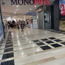 Monoprix - Entrance to the store. They sell groceries and goods (clothes, housewares, etc).