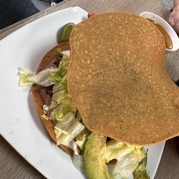 Tostadas are huge. This is the bistec Tostadas are huge. This is the bistec