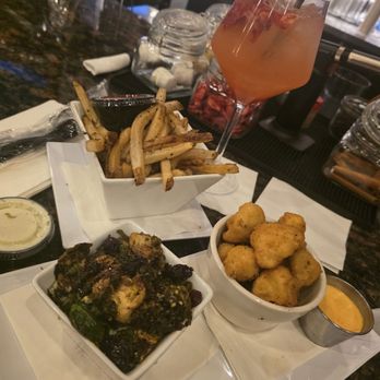 Melt Kitchen and Bar - Cauliflower. Brussel sprouts. Fries. Mocktail. - New American Near Me - Greensboro, North Carolina Melt Kitchen and Bar - Cauliflower. Brussel sprouts. Fries. Mocktail. - New American Near Me - Greensboro, North Carolina