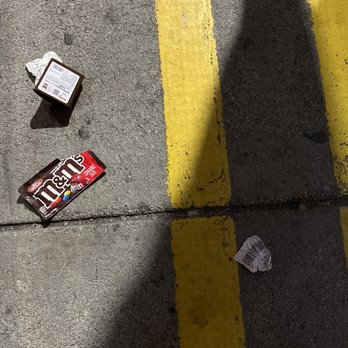 Wawa - the shadow of a person on the sidewalk - Gas Stations Near Me - Lodi, New Jersey