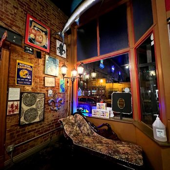 Zydeco's - a room with a couch and a surfboard - Cajun/Creole Near Me - Mooresville, Indiana