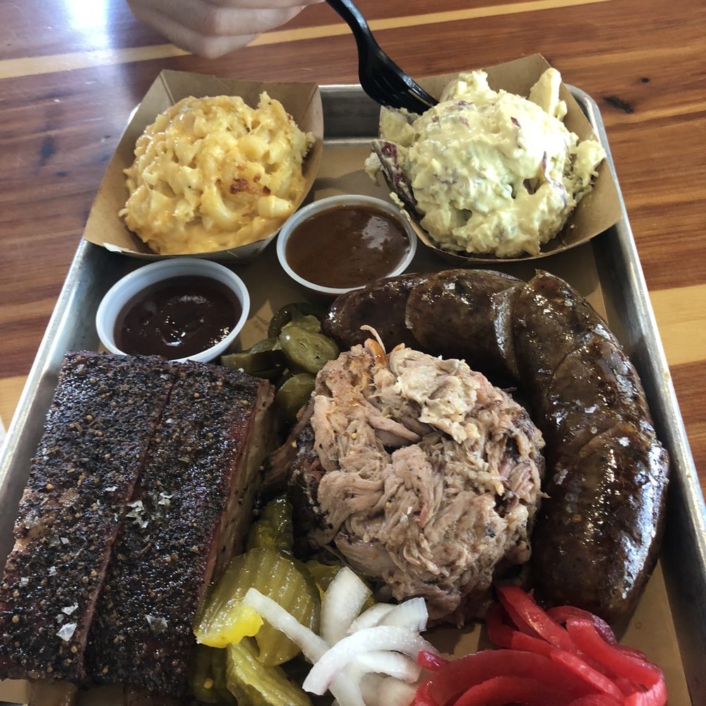 Ribs, pulled pork, links with Mac n cheese and potato salad Ribs, pulled pork, links with Mac n cheese and potato salad