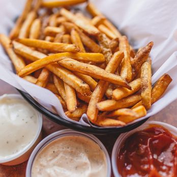Fritz - Belgian fries with three different dipping sauces. Left to right: Ranch, Parmesan Peppercorn, and Curry Ketchup - Salad Near Me - Keene, New Hampshire